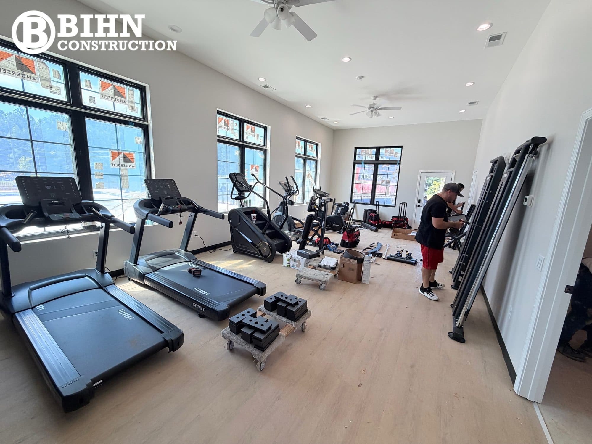 Equipment being positioned in the finished fitness room during the final fit-out