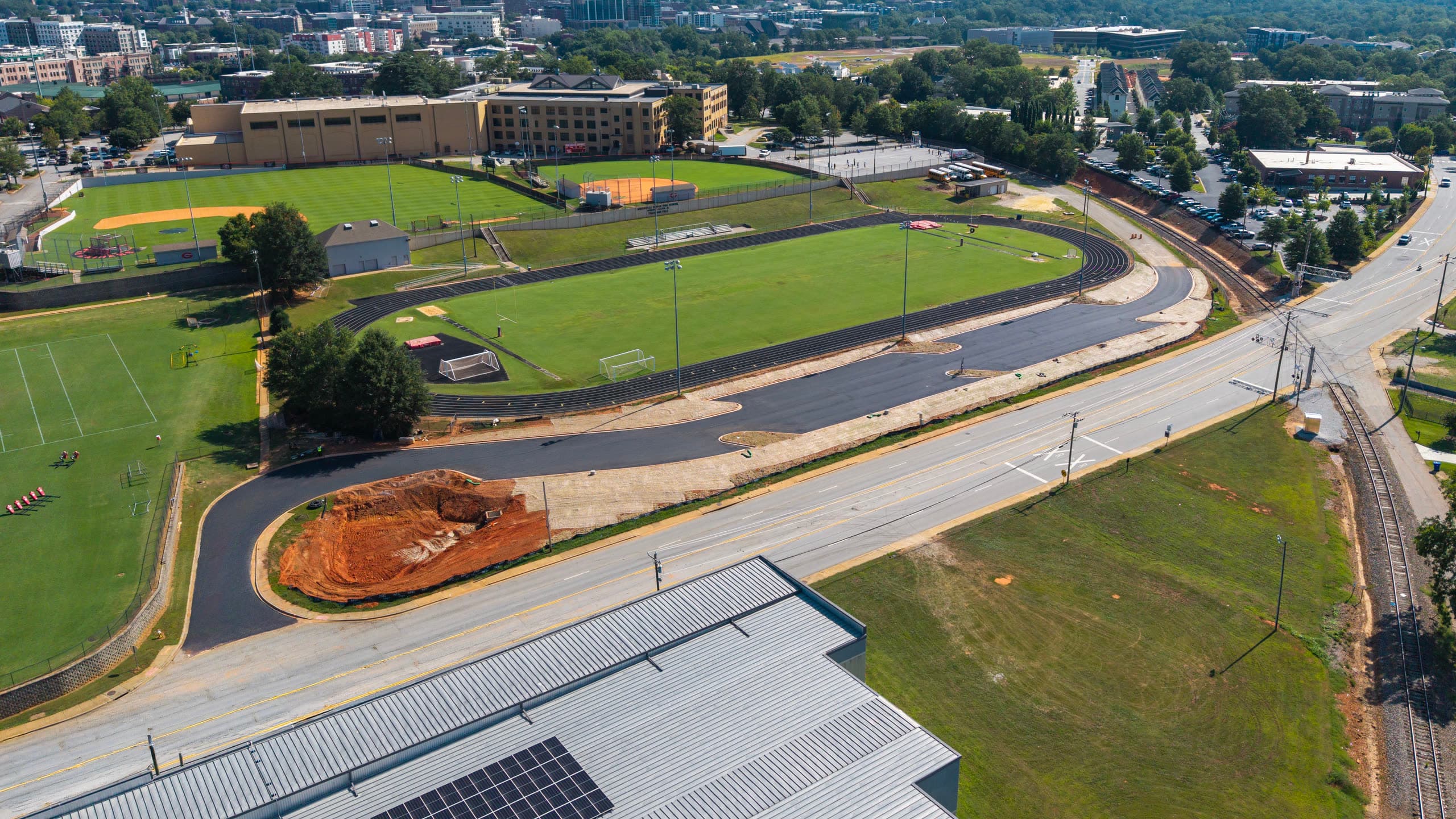 The parking lot and athletic complex with downtown Greenville on the horizon