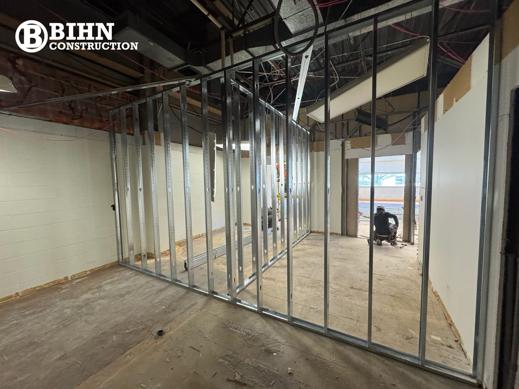 New metal stud partitions framed out across the stripped office floor